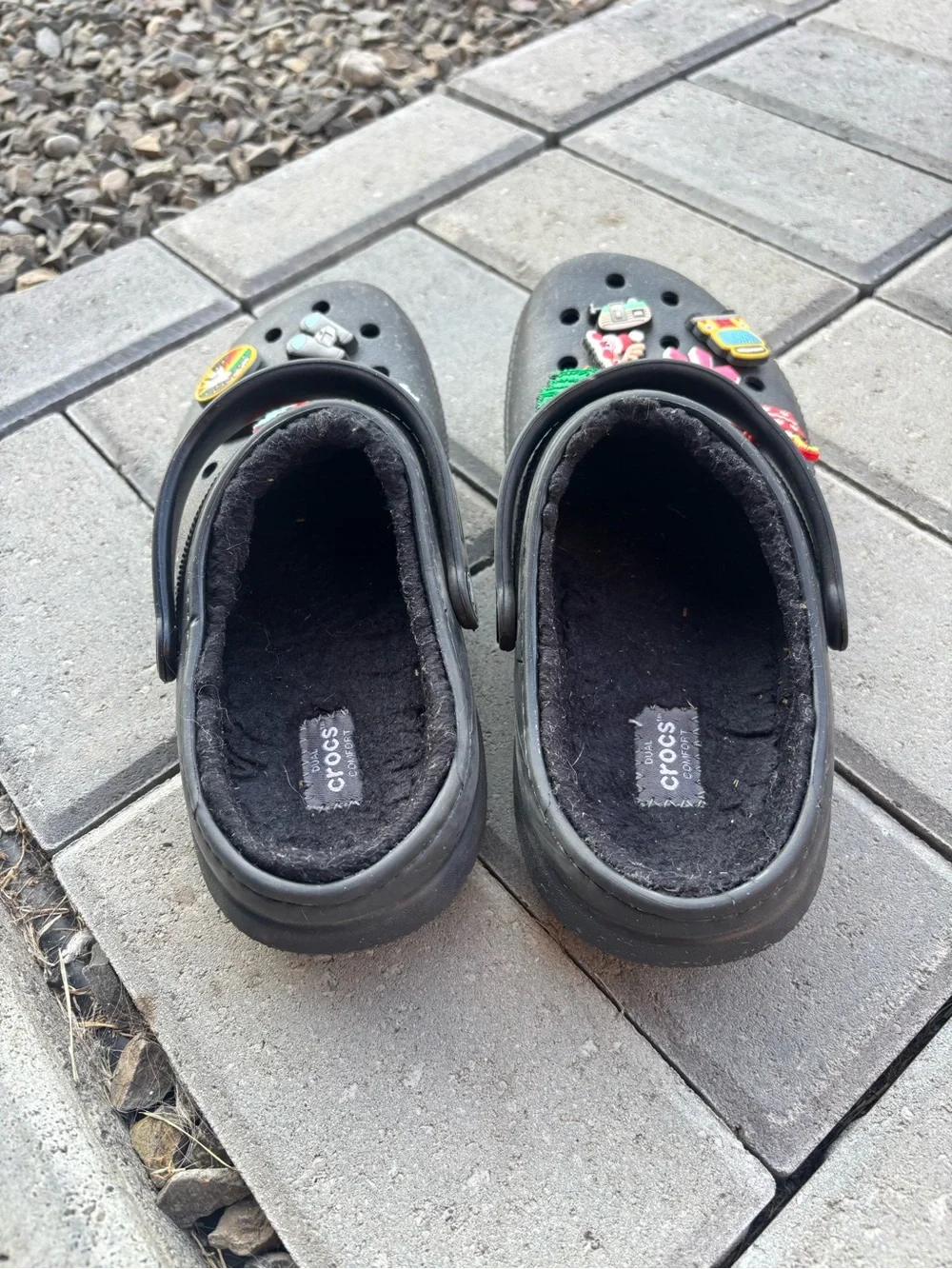 These are black lined classic black CROC Clogs featuring holiday Jibbitz charms